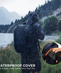 Angler using All In One Tackle Backpack With Rod Holders And Four Tackle Boxes Plus Rain Cover in rainy outdoor setting