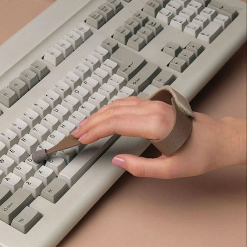 Hand using Game Changing Keyboard Typing Assistant Accessory, Four Size Options With Large Right, Large Left, Small Right, And Small Left