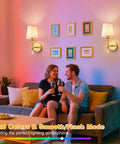 Gold Cordless Wall Sconces Set Of Two Battery Operated Rechargeable Dimmable Led Lamps With Fabric Shades, illuminating a cozy living room.