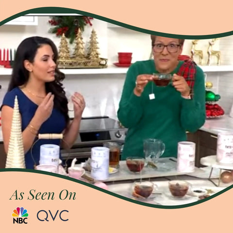 Two women demonstrate the Self Heating Mug With Phone Controlled Heat Settings And Wireless Charging Stand while enjoying tea.