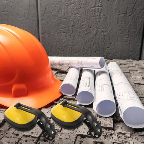 Heavy Duty Hard Hat Integrated Ear Muffs With Thick Seal Soundproof Ear Cups Built Different For Construction Crews And Job Site Pros next to orange hard hat and rolled blueprints.