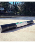 Top Shelf Synthetic Roof Underlayment 100 Gsm Knockout Waterproof Membrane roll on pavement, 48 inch by 250 feet, covers 1000 sq ft.