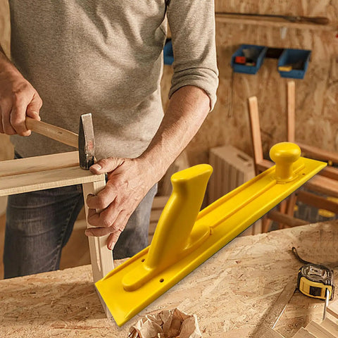 Man using heavy-duty push handle with visible yellow push block for woodworking tables and router tables, safe precision cuts tool.