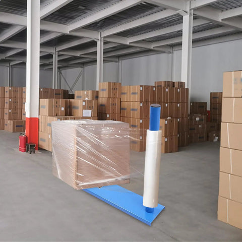 Heavy Duty Manual Stretch Film Dispenser With Pro Grade Wrap Bench Built Like A Tank To Crush Heavy Pallets and wrapped pallet in warehouse.