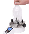 TT01 Cap Torque Tester With 100 LbFin Capacity, Adjustable Posts And Jaws, Automatic Data Output And Zeroing, First And Second Peak Detection For Slip And Breakaway Torques In Tamper Evident Closures. Bottle cap torque test on 1 L plastic bottle.