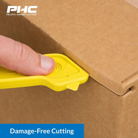 Heavy Duty Dual Head Concealed Safety Cutter Hits Different For Slicing Shrink Wrap Film Cardboard And Plastic Straps With Recessed Blades For Zero Slip Protection And No Sweat All Day Long in use on a cardboard box.