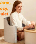 Woman using laptop with Under Desk Electric Foot Warmer For Office And Home Quiet Portable Cozy Feet Warmer, gray cylinder
