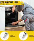 Person using Fathers Day Gift For Dad And Men 9 In 1 Multitool Pen With LED Light to fix oven with screwdriver tips displayed.