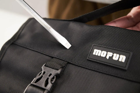 Close-up of the roll pouch from 64 Piece Motorcycle Tool Kit With Roll Pouch For Harley Davidson And All Models Built To Tackle Any Trail Or Street Ride Includes Long Pattern Wrench Set Spark Plug Socket Metric Hex Keys Star Keys And More Universal SAE Metric Sockets Ride Ready