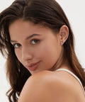 Six Pairs 14K Gold Plated Stud Earrings For Women With Hypoallergenic Cuff Cartilage Styles, Multi Piercing Friendly Dainty Stackable Set, Includes Tiny Hoops And Ball Earrings, Your Go To Gift Jewelry For Everyday Wear. Model wearing gold star stud earrings on ear