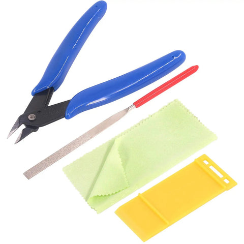 Close-up of Ten Piece Model Tools Craft Set For Beginners To Pros Modeler Building Kit with handy cutter, file, and cloth.