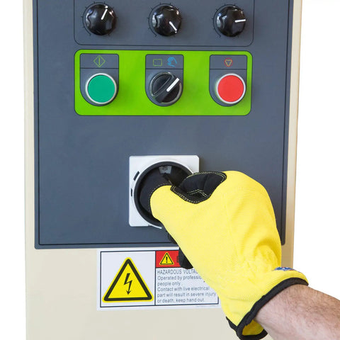 Operator using control panel on Heavy Duty Turntable Pallet Stretch Wrapper Equipped With Powered Pre Stretch Motor And Dual Spiral Wrapping Modes.