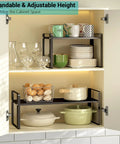 Stack Your Pantry Goods Without A Sweat, 2 Pack Expandable Cabinet Organizer Shelves, Adjustable Space Saving Heavy Duty Metal Storage Rack For Kitchen Cupboards And Under Sink, Sleek Black Finish, showcasing stacked dishes and storage.