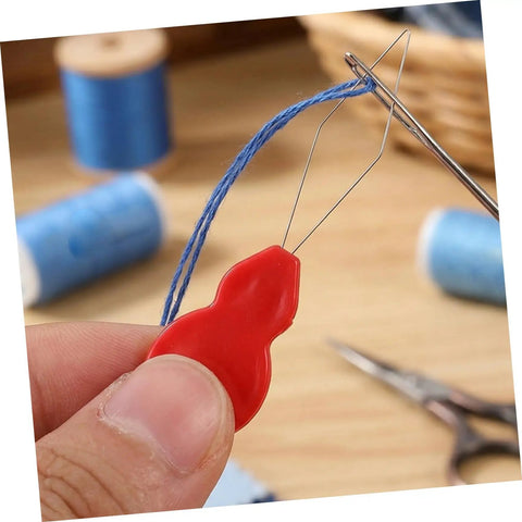 Gourd Shaped Needle Threaders 100 Pack Plastic Threading Tools For Hand Sewing And Embroidery, Effortless Threading, Versatile Use For Travel, Grab And Go DIY Crafts, And Quick Needle Tasks red plastic threader with thread in needle
