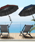 A Zero Stress UV Defense This Upf Fifty Plus Golf Umbrella Packs A Heavy Duty Universal Clamp And Fluid Tilt Arm, angled over deck chairs.