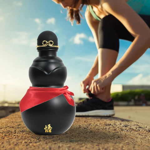 900ml Hydration Bottle With Gourd Inspired Shape For Hikers And Campers next to woman tying shoe outdoors.
