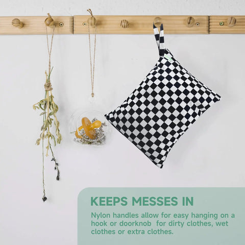 Leakproof Wet Dry Bag Set For Baby Gear 3 Pack Checkerboard Pattern hanging on wooden hook with pacifier and herbs