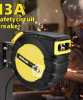 65 Ft Retractable Extension Cord Reel with 3 Grounded Outlets and Lighted Triple Tap mounted on workshop wall