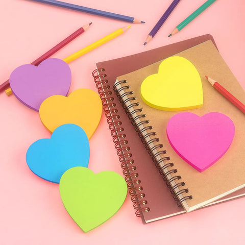 Heart Shaped Sticky Notes Set With Six Bright Colors 3 By 3 Inch Pads 75 Sheets Per Pad Easy Peel No Residue Memo Pads shown on notebook