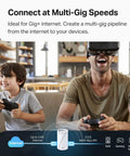 Father and son gaming with Deco 7 Pro Tri Band WiFi 7 Mesh System For Whole Home Coverage with virtual reality headset and controller.