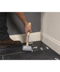 Person using Built Tough Heavy Duty Solid Rubber Mallet With 20 Oz Head And Hardwood Handle Made In The USA for tile work