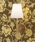 Modern wall sconce against Premium Brown Gold Metallic Wallpaper With Block Print And Textured Finish For Modern Home Decor.