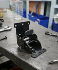 Three Piece Black Folding Table Braces With 180 Degree Self Lock Hinges For No Sweat Quick Install extension support on a workbench.