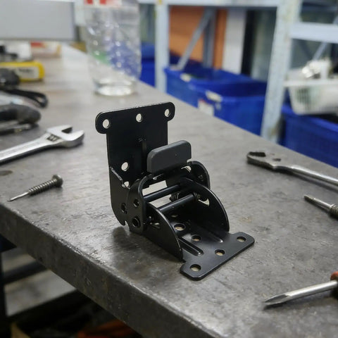 Three Piece Black Folding Table Braces With 180 Degree Self Lock Hinges For No Sweat Quick Install extension support on a workbench.