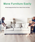 Two individuals moving a couch easily across wood flooring using Heavy Duty 24 Pack Furniture Sliders With Grip Fast Adhesive Backing And Thick Eva Foam Core Guarantees Zero Drag Movement For Couches And Weighty Dinette Sets Preserves All Floor Types During No Sweat Moving Days Black.