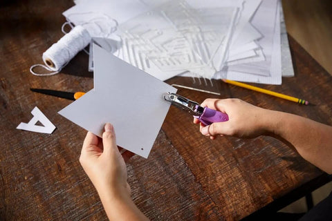 Person using One Sixteenth Inch Circle Hole Punch With Ergonomic Cushioned Grip for crafting on thick paper