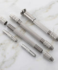Top Shelf 3 Piece Pin Vise Set Featuring Double Ended Hand Drills With Solid Brass Chucks on marble surface.