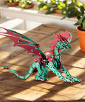 Side view of 3D Dope Metal Dragon Model Kit For Adults And Builders Mechanical Puzzle Building Set in red and green on a wooden table.
