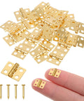 24 Pcs Dollhouse Hinges 10x8mm 180 Degree Stainless Steel Gold Tiny Hinges For Miniature Furniture And Jewelry Boxes With 96 Screws Included By SynHHnergyx, shown with screws and finger for scale