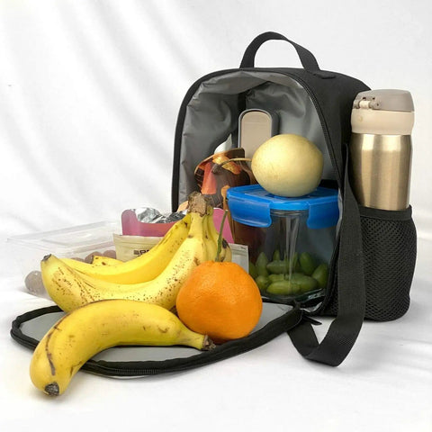 Ultimate Kickass Insulated Lunch Bag For Guys And Gals Featuring Hella Tough Leak Proof Peva Lining Heavy Duty Cooler Tote With Adjustable Shoulder Strap For Grabbing Daily Meals On The Move filled with fruits and a water bottle.