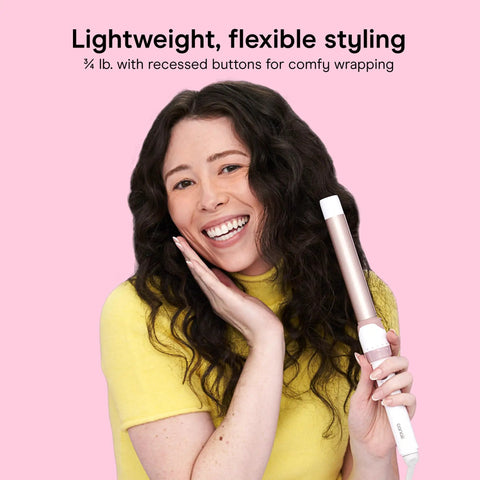 Woman holding Double Ceramic One Inch Clamp Free Curling Wand for effortless beachy waves, showing flexible styling benefits.