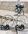 Heavy Duty Mechanical Disc Brake Pair For Ebikes And Folding Bikes Featuring 160mm Front Rear Aluminum Rotors on wooden surface.