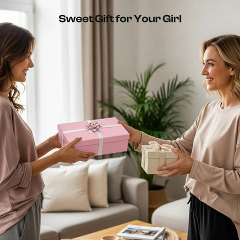 Two women exchanging gift boxes in a living room with a pink box labeled 'Sweet Gift for Your Girl' on the table.