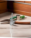 Essential 2Pc Internal And External Pipe Threader Tool Kit For Pvc Plastic Pipes with a silver threader and pliers on countertop.