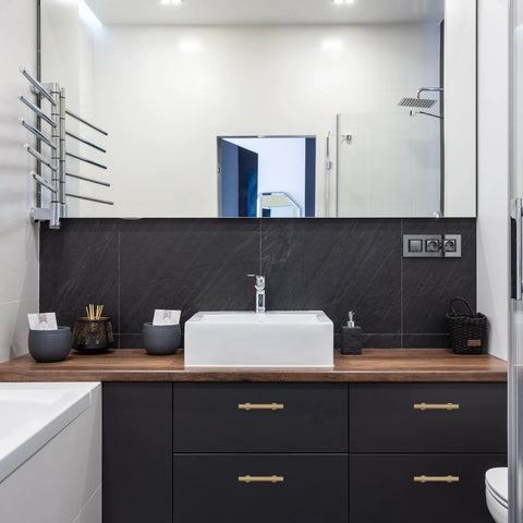 Bathroom vanity with 6-Pack Solid Brass Cabinet Pulls in Brushed Gold Finish, single hole, on modern furniture