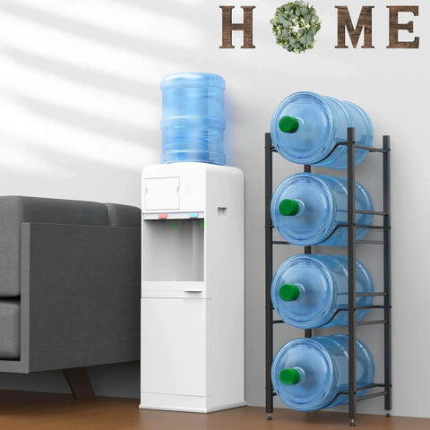 Five Gallon Water Jug Holder Rack Built to Last Heavy Duty Steel 4 Tier Storage Organizer for Kitchen Home Office Pantry Rustproof Black Painted Finish Space Saving and Sturdy Water Bottle Storage next to water cooler and sofa.