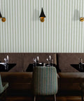 Kickin Green Stripe Textured Vinyl Wallpaper With Rock Solid Durability For Commercial And Home Spaces Custom Printed Top Shelf Heavy Wallcovering in a restaurant setting.