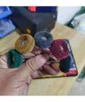 Five nylon abrasive wheels in hand, various colors for precision polishing. Must-Have 10-Piece Nylon Abrasive Wheel Kit With 120 To 600 Grit For Precision Polishing And Buffing Metal Surfaces Using 2.35 Or 3mm Shank Rotary Tools.