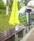 Heavy Duty Umbrella Clamp Holder For Patios And Beach Tents Adjustable Outdoor Shade Mount fits a bench with yellow umbrella.