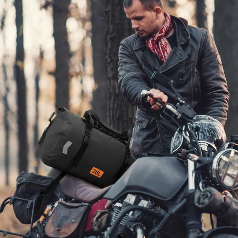 Motorcyclist with Waterproof 30L Motorcycle Dry Bag With Roll Top Closure Air Valve And Quick Fix Straps Rugged All Weather Gear