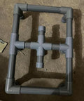 Assembled frame with six pieces three quarter inch grey electrical conduit PVC pipe seventeen inches long Sch40 rigid tube round pipes.