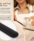 Go To Sourdough Starter Kit With 34oz Starter Jar and silicone spatula pouring batter