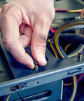Installing Must Have M6 Standoff Screws Set, Brass Hex PCB Spacers, on a motherboard build, gold tone finish, 10mm length
