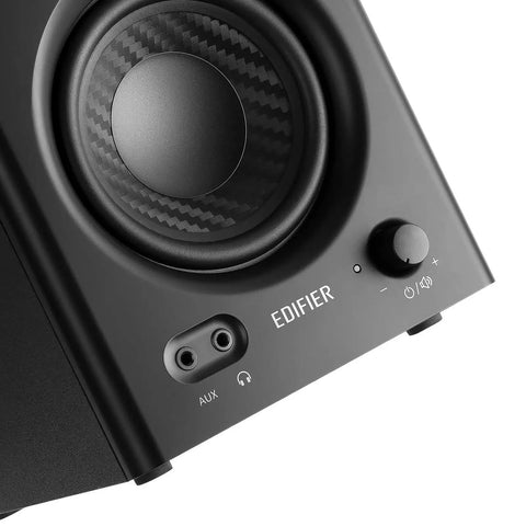 Close-up of MR4 Powered Studio Monitor Speaker front panel with volume knob and input jacks in black for home studio use.