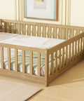 Queen Floor Bed With Safety Guardrails in Natural Rubber Wood Finish with mattress in modern bedroom setting