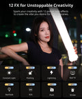 Person holding Bi Color 20W Inflatable LED Tube Light For On The Go Filming Portable Handheld Magnetic Mount in urban setting